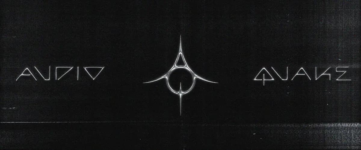 Značka Audioquake na černém podkladu